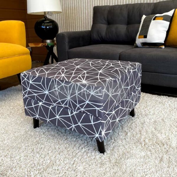 grey printed ottoman with wooden legs