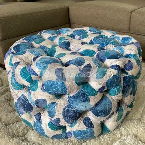 ottoman round pouffe with blue floral print with quilted upholstery