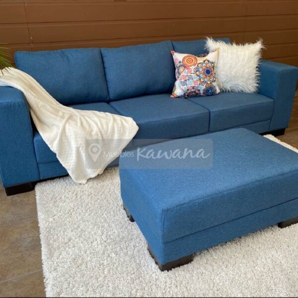 living room with mobile ottoman in blue linen